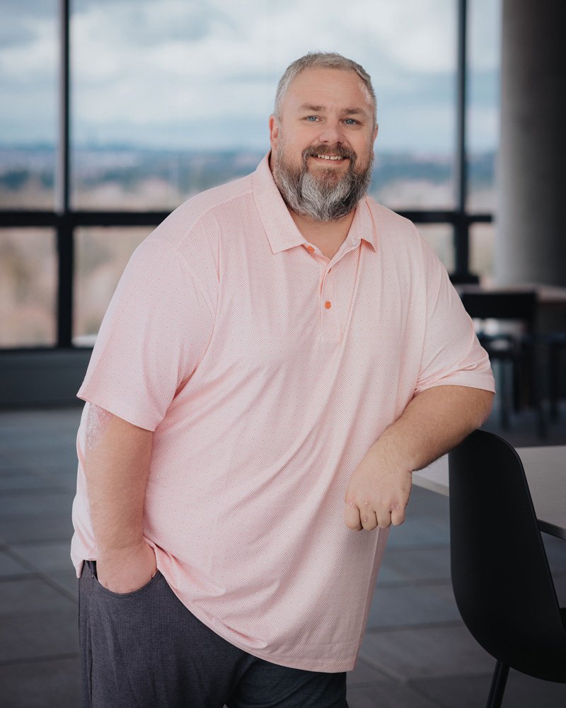 Professional headshot of Derrek Bennett